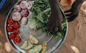 Cooking demonstration of vegetables harvested at a home garden in Niger