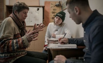 Kateryna* an IDP, takes part on a psychosocial support session. Kateryna* has been here for 9 months. She left her hometown in March. Photo: Simona Supino