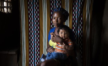 Liberian woman holds her infant child