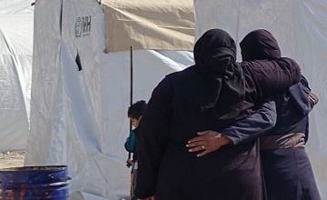 Women comfort each other in northern Syria following the February 6, 2023 earthquake