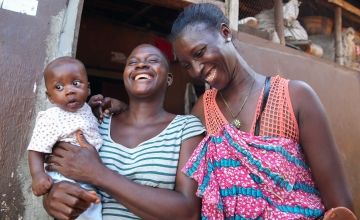 Sierra Leonean mother and her infant son meet with a health advisor as part of a programme designed to lower infant mortality rates.