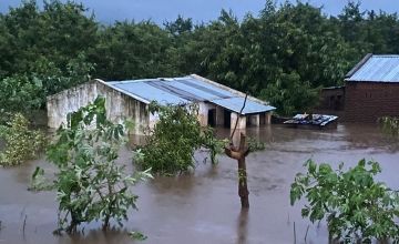 Floodwater rising over houses and trees after Cyclone Freddy in Malawi