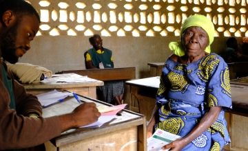 Christine awaits voucher for cash assistance in DRC 