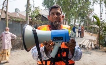 Ashraf is the president of the committee alert group, which warns community members of impending flooding and distributes lifejackets. Photo: Gavin Douglas/Concern Worldwide