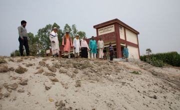 The local school has been built upon a raised embankement, protecting it from flooding. Photo: Gavin Douglas / Concern Worldwide