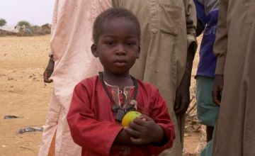 Ameen*, a young boy, at the Chad border after fleeing Sudan