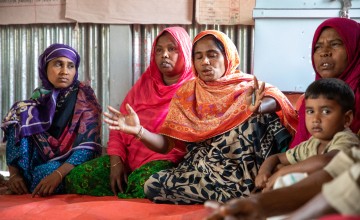 Members of the mixed-gender self-help group prepare collectively for flooding. Gavin Douglas / Concern Worldwide