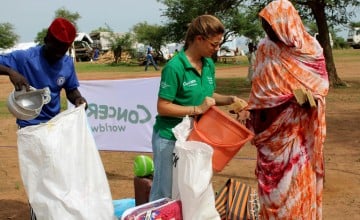 Concern staff member assisting Sudanese refugees at Chad border