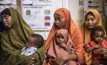 Women and babies wait in the Obosibo Halane Health Centre in Mogadishu