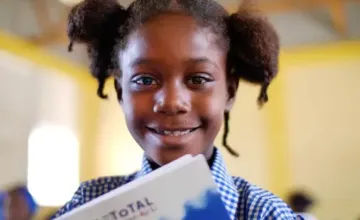 Eight year old Darline Alténor Fadner, a participant in the Concern-supported mother tongue education initiative in Ecole Bon Samaritan De Durverger, Saut d'Eau, Haiti