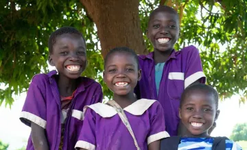 Yohane, 13, Yesaya, 10, Salayi, 8 and Luth, 6 in their school uniforms that their parents could afford with the money they received from Concern Worldwide, Manjolo Village, Nsanje District