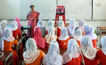 Sumaiya Parvin, a staff of Concern Worldwide and its partner organizations, is taking a session with young girls and adolescents in Rajapur High School in Shoronkhola. In the session, girls receive information about menstrual hygiene and the importance of hygiene, including nutrition information. During the session, girls participate in group discussion and often gather to address their health-related issues related to menstrual taboos and basic hygiene.