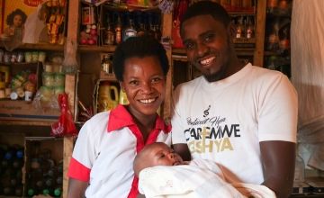 Jean de Dieu and Riberi with their three-month-old daughter Keza.