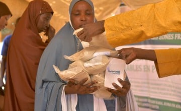 In Niger's conflict-gripped Tahoua region, Mariama Hamidou receives 6 kilograms of fortified flour from Concern Worldwide. She will use it to prepare porridge for her child.