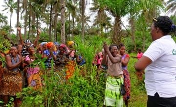 Programme Participants welcome Concern staff to their groundnut plot outside Mathonko in Sierra Leone's Port Loko district