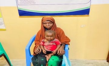 Halima (with her grandmother, Sadia) after completing her treatment, weighing 9.5 kg. Photo: Caafimaad Consortium/Concern Worldwide