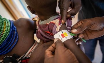 An example of a MUAC band being applied (Halima is not pictured), with the result bordering between red (severe acute malnutrition) and yellow (risk of acute malnutrition). Green indicates adequate nourishment. Photo: Eugene Ikua/Concern Worldwide