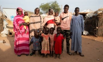 Zahra*'s family from left to right: Nurasham* (20) with her son Kosso* (2), Fadoul* (25), Zahra* (37) with her youngest son Ahmat* (14 months), Younous* (18) and Abdurahim* (15). The children in the front row, from left: Oumar* (2), Lina* (3), Nejla* (3) and Rania* (3). Photo: Eugene Ikua/Concern Worldwide