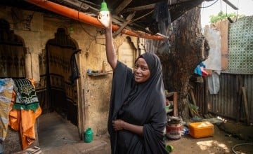 Idil* turning on the solar light she received as part of the Green graduation programme by Concern. (Photo: Mustafa Saeed/Concern Worldwide)