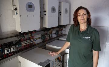 Sinead Clear in Concern Liberia office with some of the equipment used to power the Monrovia office via solar energy