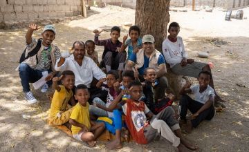 Abdul Ghaffar, Concern Programme Director and Health facility Manager with children of a small village in Tuban district, Lahj Governorate where Concern is providing health and nutrition services