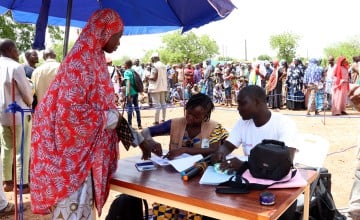Concern staff checking and unloading produce for the distribution of food in Burkina Faso.