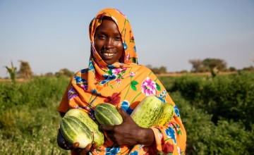 Mahadia Gamar (24) showcases her cucumbers at her farm in Karo village. (Photo: Eugene Ikua/Concern Worldwide)