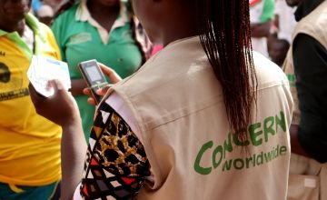 Concern staff lead a food distribution in Pouytenga, Burkina Faso. (Photo: Concern Worldwide)