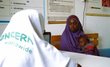 Amburo (28), with her youngest child, visits the Concern Maternal & Child Health Centre in Daynile District, Mogadishu. This is where she was registered for cash assistance. Photo: Adnan Mohamed/Concern Worldwide