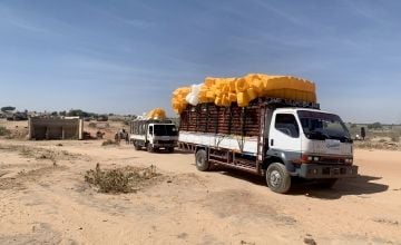 Concern trucks transporting humanitarian supplies across the Chad-Sudan border into West Darfur. Photo: Johannes Davies/Concern Worldwide