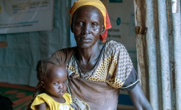 Nyacanya Chatiem with her grandchild Liakuoth