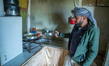 Khaled* in the kitchen area of his family's temporary home in Mt. Lebanon. (Photo: Gavin Douglas/Concern Worldwide)