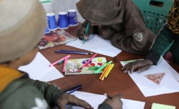 A drawing class at a non-formal education centre (NFE) for displaced children in Syria. NFEs are designed to help give children a sense of well-being and normalcy after experiencing trauma so that they can re-enter a formal education system when they're ready. (Photo: Jennifer Nolan/Concern Worldwide)