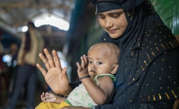 Ayesha* (25) a Rohingya mother visits the Concern nutrition centre with her malnourished son Anwar* (9 months) to receive ready-to-use therapeutic food (RUTF) in the nutrition centre at Camp 13, Ukhiya, Cox's Bazar. (Photo: Saikat Mojumder/Concern Worldwide)