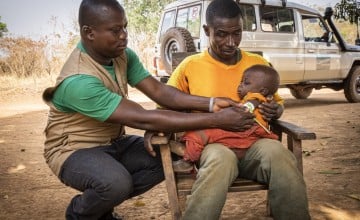 Concern's Lauran Moumbe and Alain* measure baby Christian*'s mid-upper-arm circumference (MUAC) to check for malnutrition. (Photo: Ed Ram/Concern Worldwide)