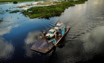 A Concern Worldwide team using a ferry along the Lualaba river, Manono Territory, Democratic Republic of Congo. Photo: Hugh Kinsella Cunningham/Concern Worldwide