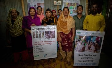 Posters to raise awareness on gender equality and domestic violence prevention are hung up in dhaka by the concern-supported changemaker group.com (Photo: Gavin Douglas/Concern Worldwide)