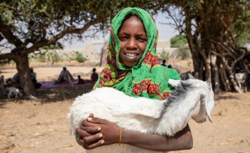 Salmata's daughter, Aichta (9), holds up one of the family's goats in Ndjati Village. Photo: Eugene Ikua/Concern Worldwide