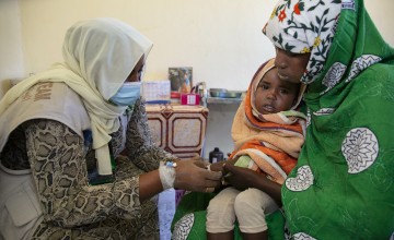 Mona Salh with her son, Faiza Abdullah (3) at Um Shalaya health centre in Central Darfur, Sudan. 