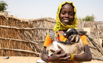 Mariam holding her goat in Chad