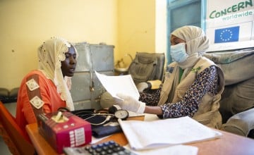 Doctor Fatima Daoud with Salwa Abaker and her 10-month-old daughter Adan at Um Shalaya health centre in Central Darfur, Sudan. 