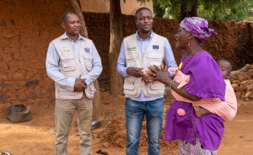 Community health volunteer and grandmother Mariama Badje speaks with Concern's Technical Surge Specialist Issifou Gouzaye and Nutritional Health Advisor Mohamed Djibrillou.