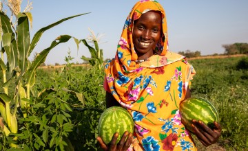 Mahadia Gamar (24) showcases her watermelon at her farm in Karo village