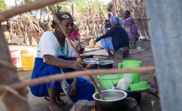 Mwanajuma Ghamaharo prepares breakfast outside her home in Makere village in Tana River County. Photo: Lisa Murray/Concern Worldwide