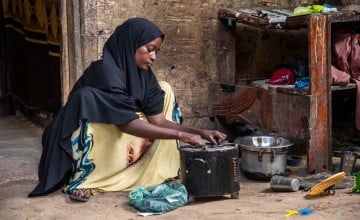 Idil* a mother of seven children, sells clothes and shoes in Wadajir district. Through a self-help group, she was able to enrol in various training programmes for business and household management, including improving how to solve household issues as a couple. The business training taught her how to read and write, as well as how to do maths and calculate her earnings. Photo: Mustafa Saeed/Concern Worldwide