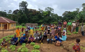 Community members, health workers and local partners at a community garden in Kamboma, supporting improved access to diverse diets, as part of the Concern-led programme Saving Lives in Sierra Leone. Photo: Concern Worldwide