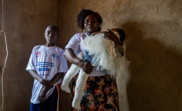 Mother-of-nine Claire Masika Muisa (48) with her son Jonathan and daughter Ebenezer (2)