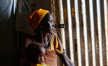Nyacanya Chatiem with her grandchild Liakuoth (2) attending Kuach PHCC Nutrition clinic in Guit County, South Sudan. Photo: Eugene Ikua/Concern Worldwide