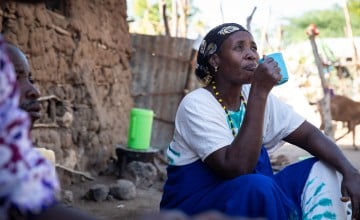 Mwanajuma Ghamaharo eats breakfast at her home in Makere village in Tana River County. She participated in Concern and ADM's LEAF Project. As a result, her county didn't need emergency food aid for the first time in decades. Photo: Lisa Murray/Concern Worldwide