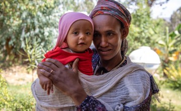 Meseret Sisay with her 8-month-old daughter Birtukan Teklu. While pregnant, Meseret received support from a mother-to-mother group as part of ERNE in Ethiopia. As a result, she says her daughter has had a healthier infancy than her first two children. Photo: Eugene Ikua/Concern Worldwide